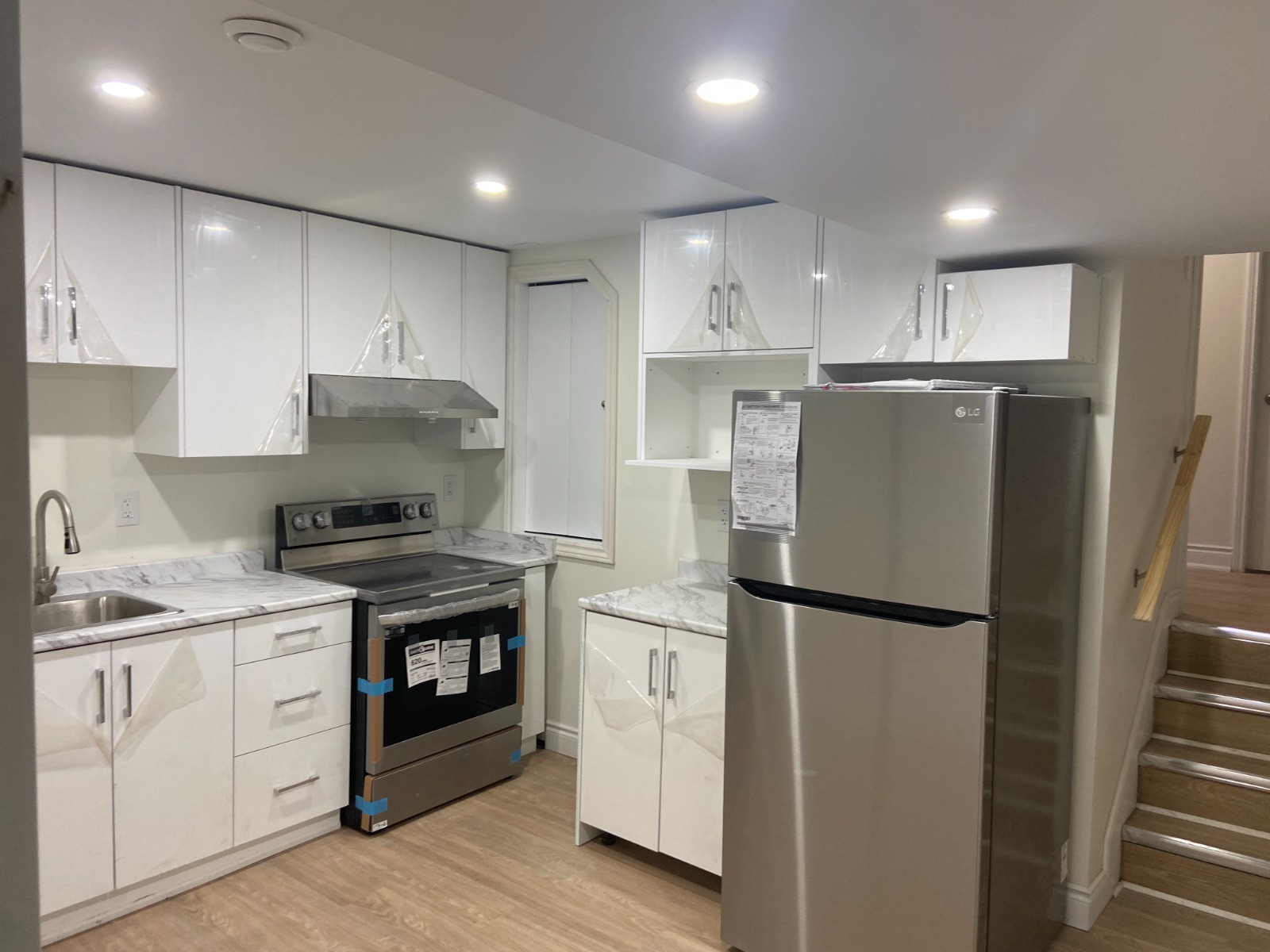 Bright kitchen with newly installed white cabinets