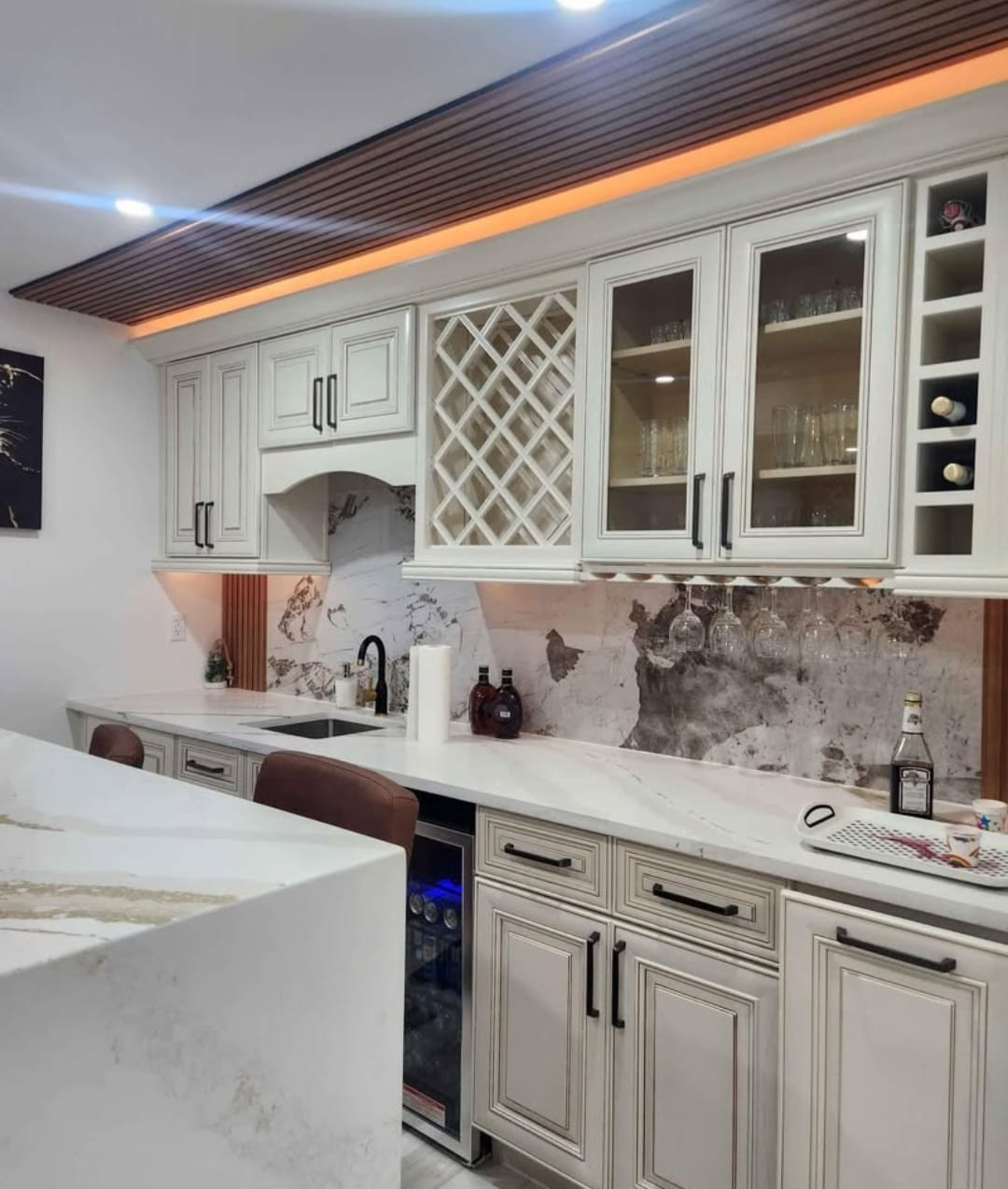 Classic cream kitchen cabinets with decorative glass doors