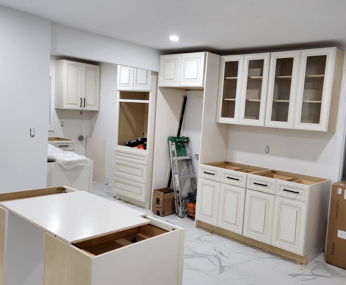 Custom kitchen cabinet installation with island and wall cabinets