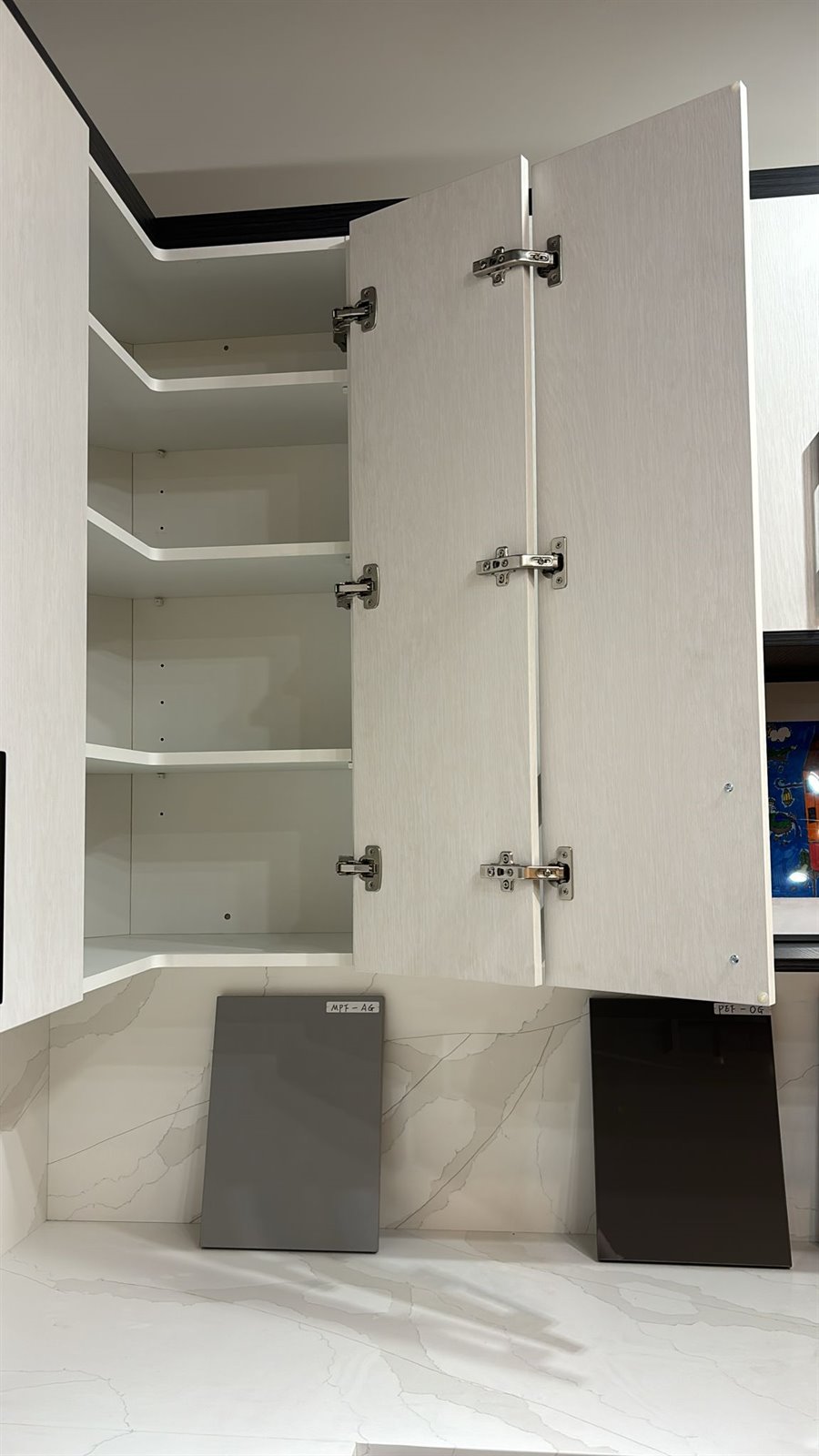 Tall storage cabinet interior with open doors