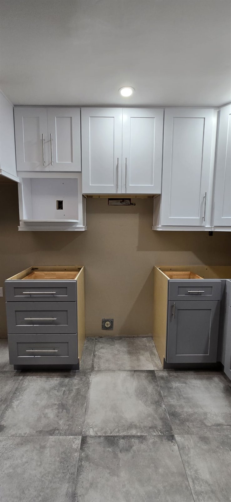 Wall cabinets installation in progress