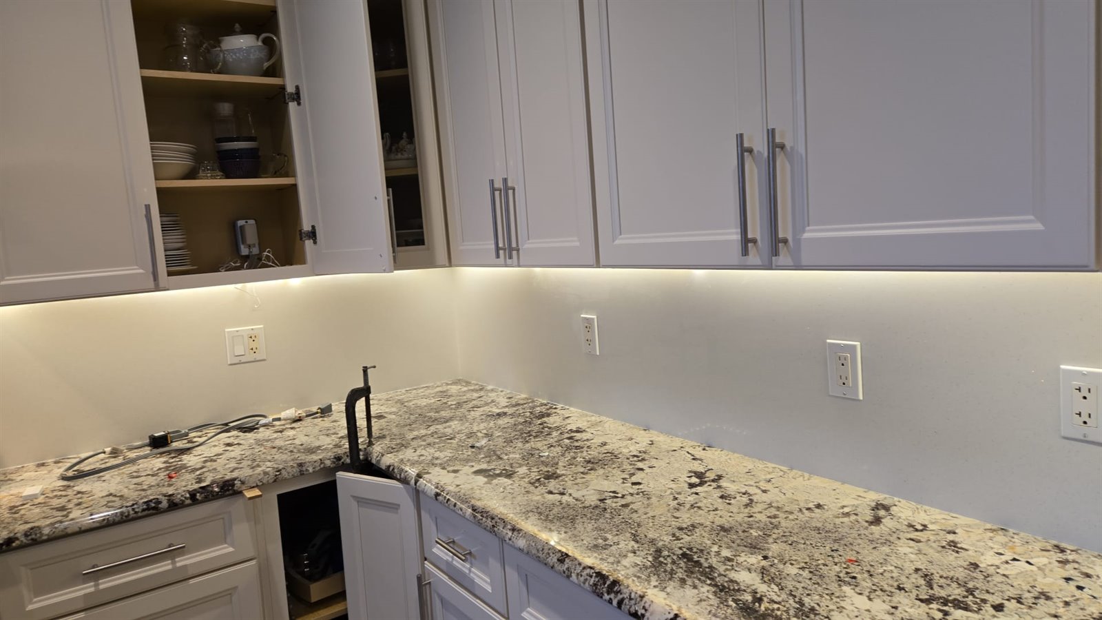 White cabinets with stone countertop