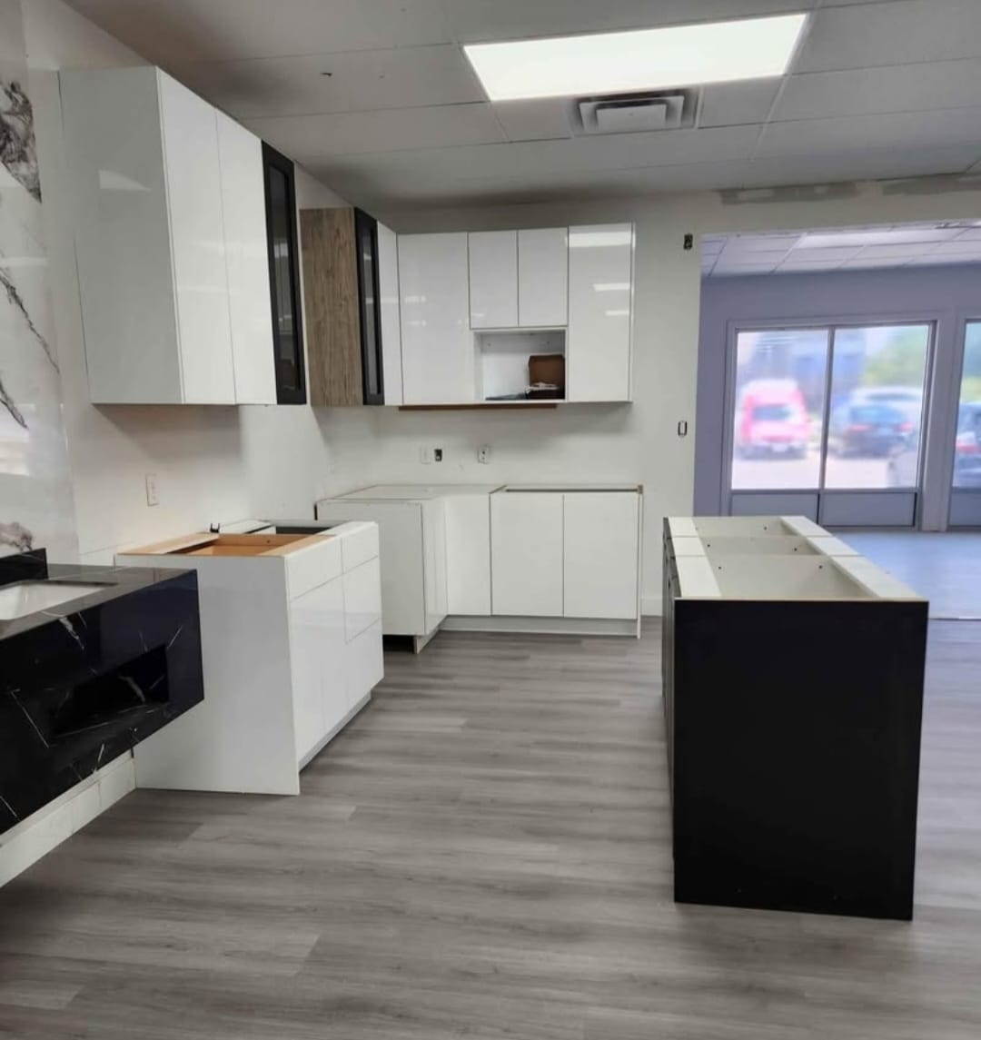White kitchen cabinets and island in a bright renovation